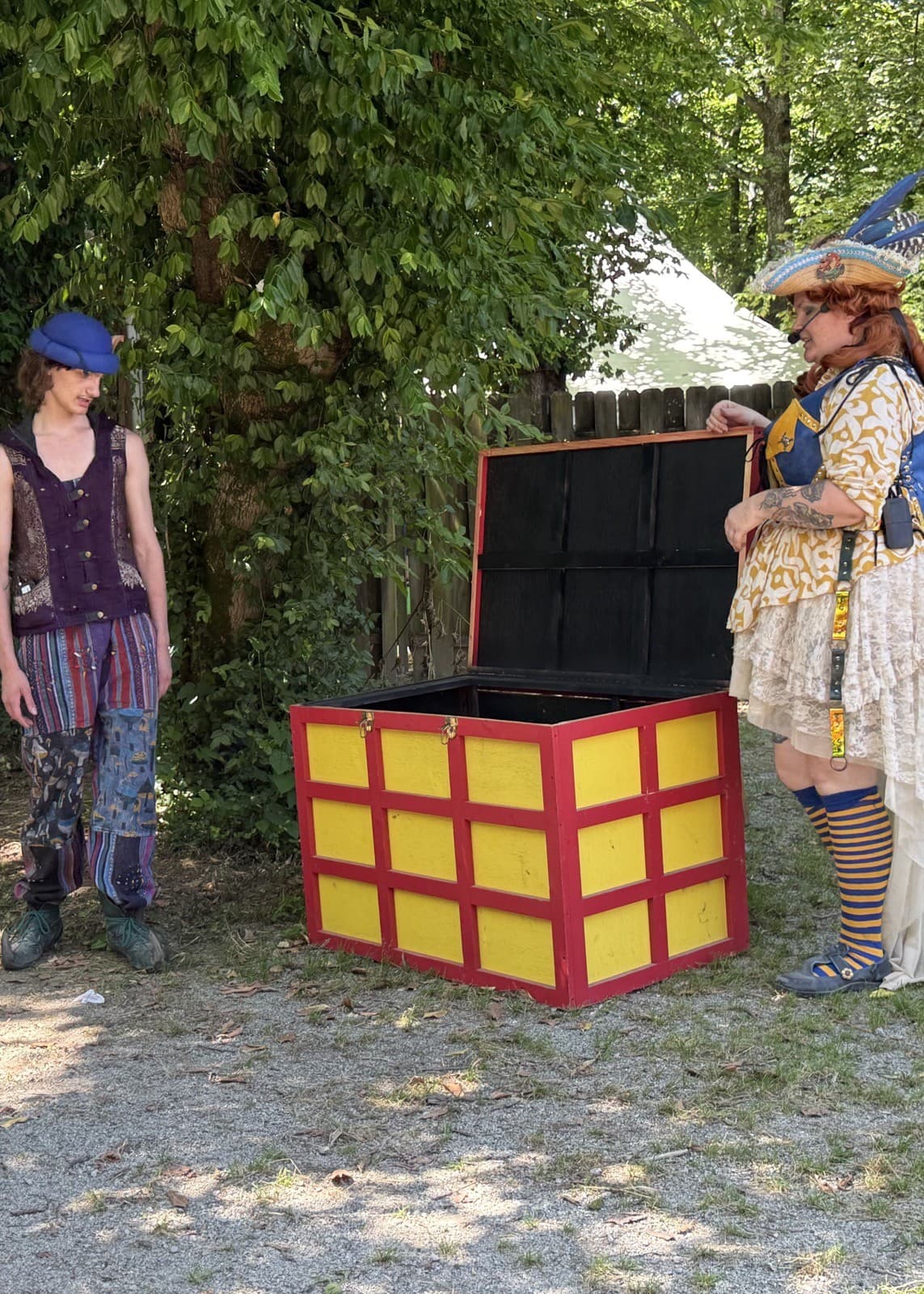 Captain Shh-nel and Stu of the Loo beside the big open red-and-yellow prop chest during the Victoria's Secret Chest illusion